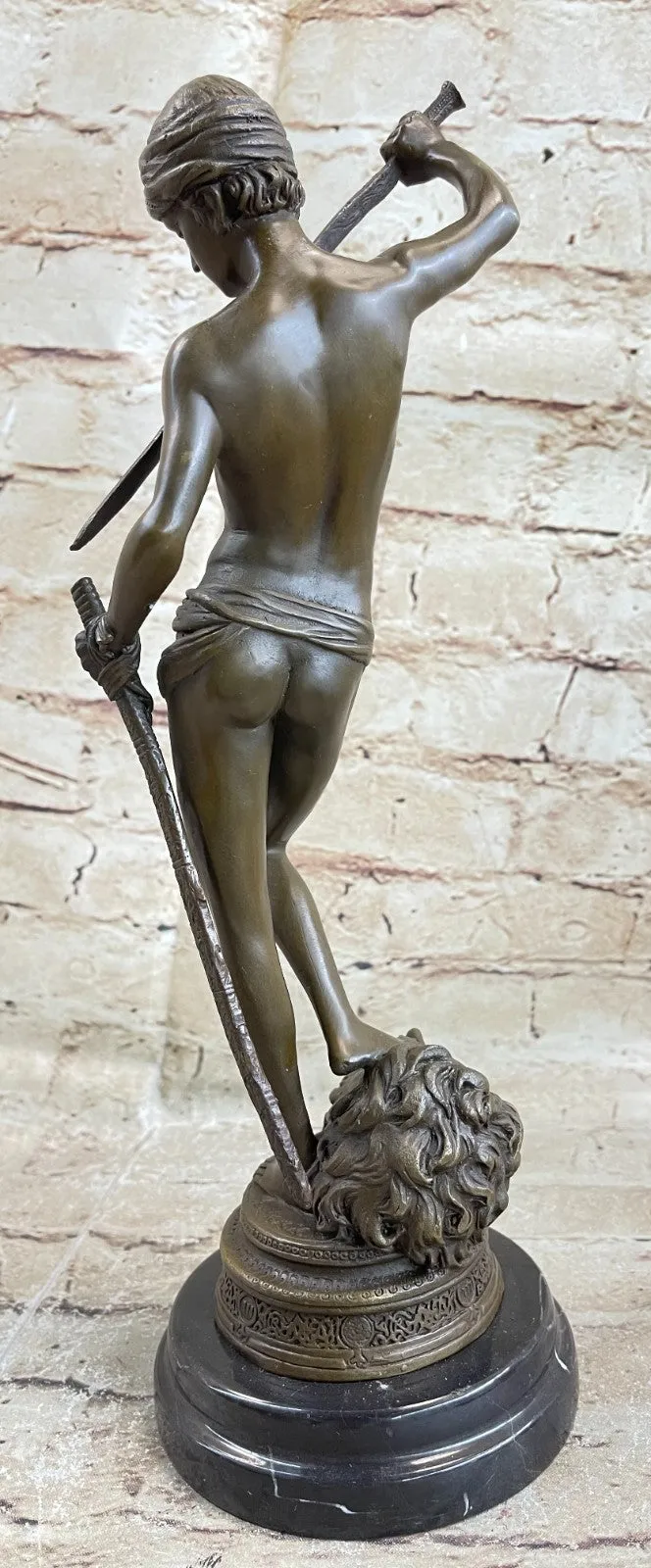 Turn of century bronze statue representing David and Goliath. Signed "A. Mercie