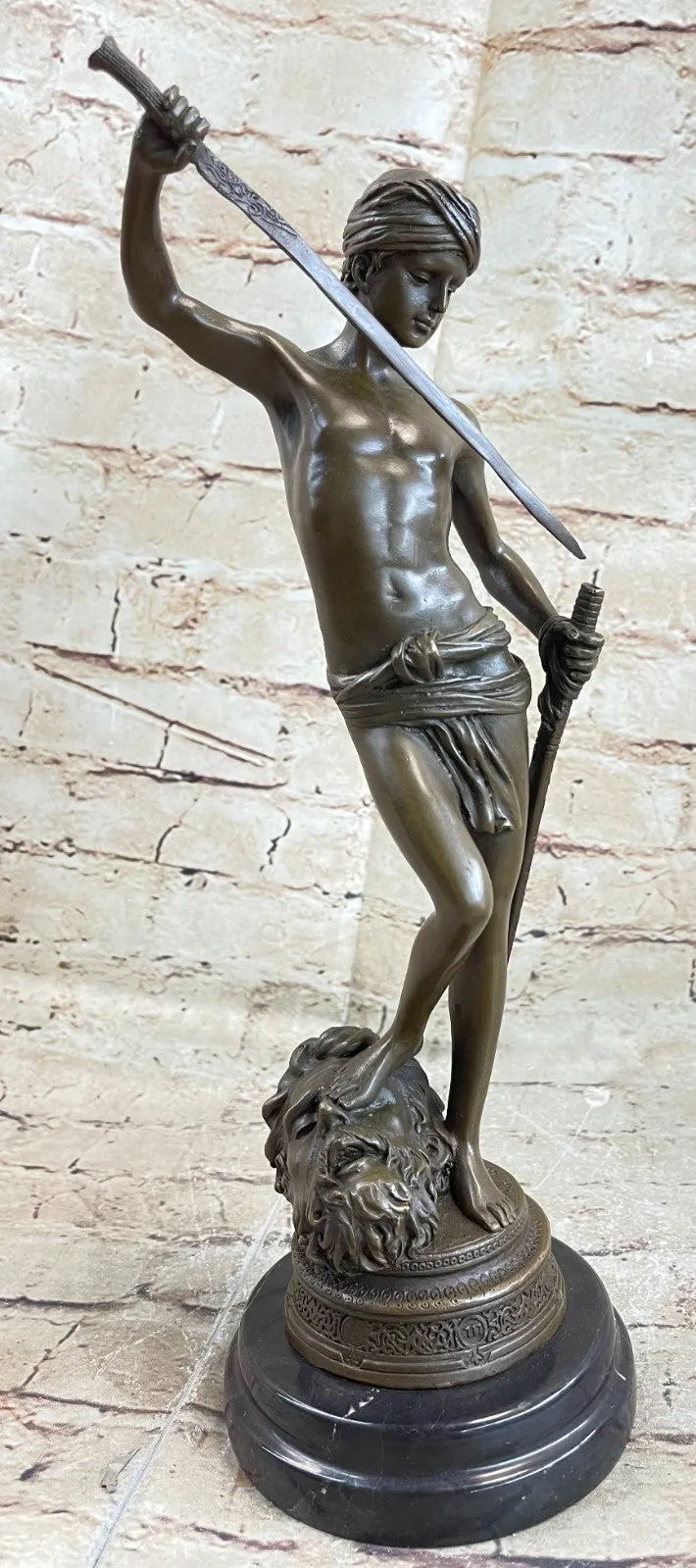 Turn of century bronze statue representing David and Goliath. Signed "A. Mercie